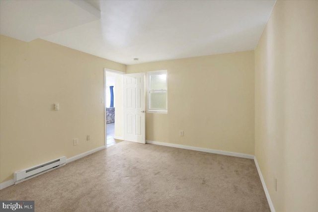 unfurnished room with light carpet and a baseboard radiator