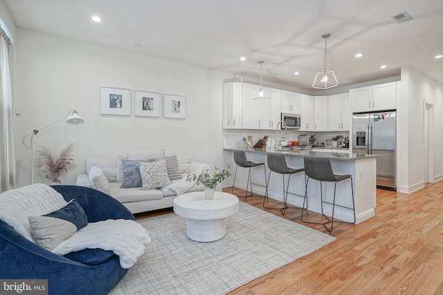 living room featuring light hardwood / wood-style flooring