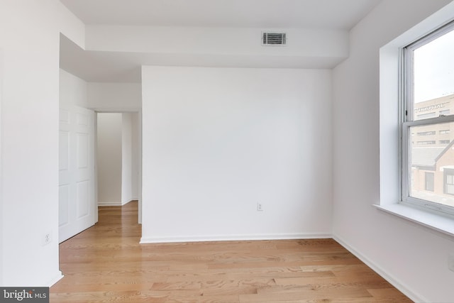 empty room with light hardwood / wood-style floors