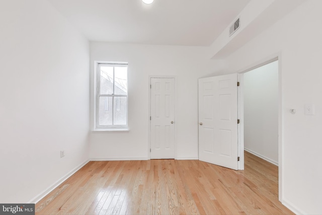 unfurnished bedroom with light wood-type flooring