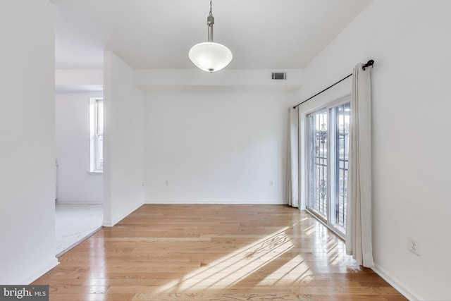 unfurnished room featuring light hardwood / wood-style flooring