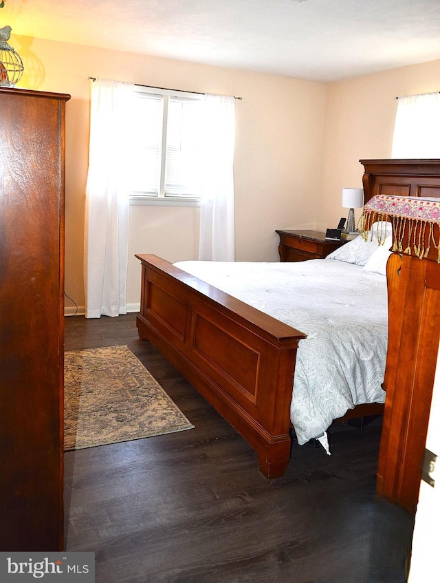 bedroom featuring dark wood-type flooring