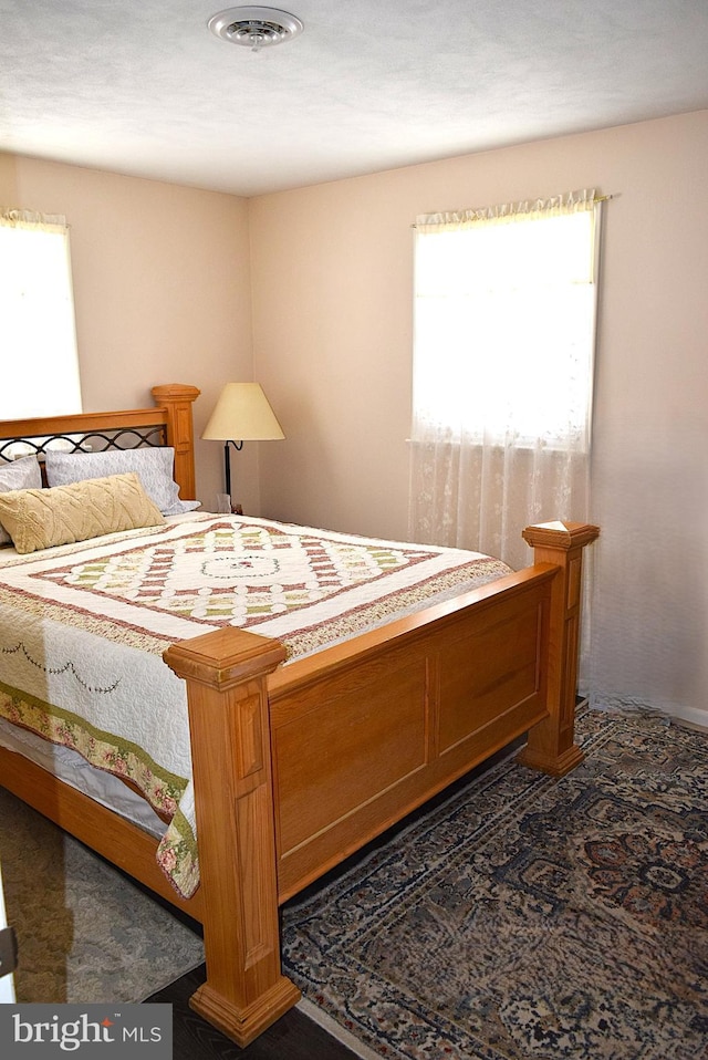 bedroom featuring multiple windows