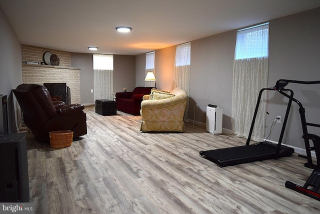 living room featuring a fireplace and light hardwood / wood-style flooring