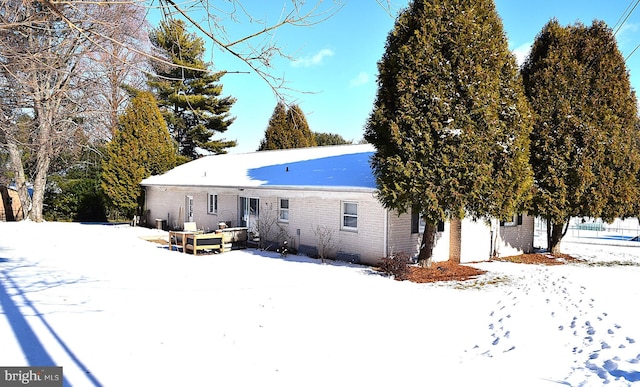 view of snow covered house