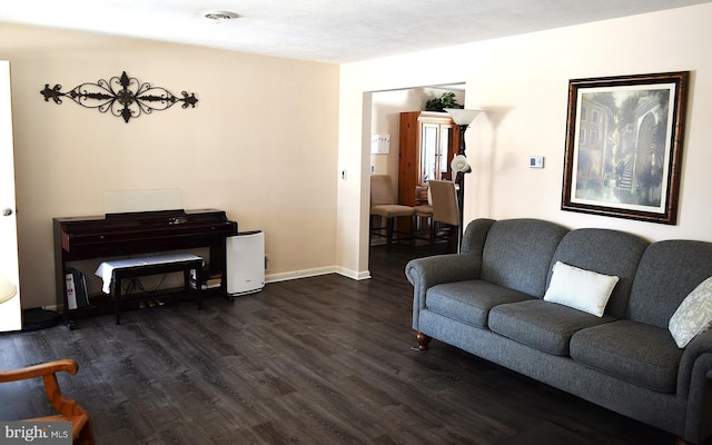 living room with dark hardwood / wood-style floors