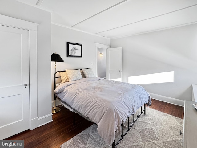 bedroom with hardwood / wood-style flooring and ornamental molding