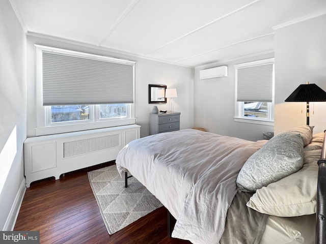 bedroom featuring an AC wall unit, radiator, crown molding, and dark hardwood / wood-style floors