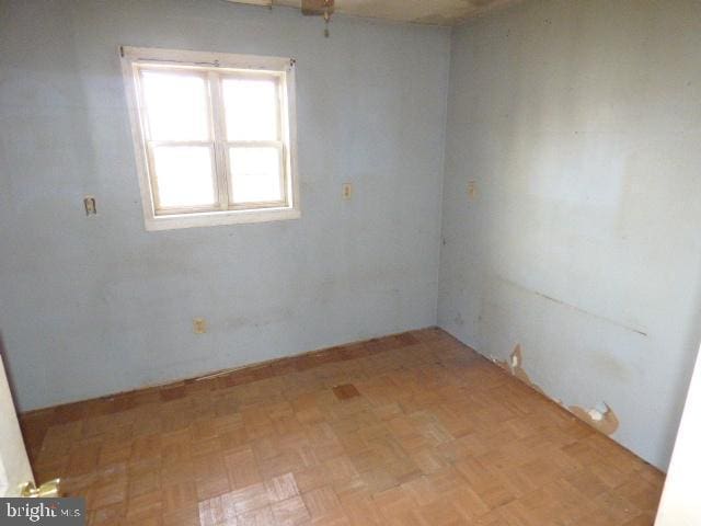 empty room with light parquet flooring