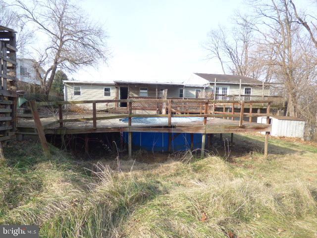 back of property with a deck