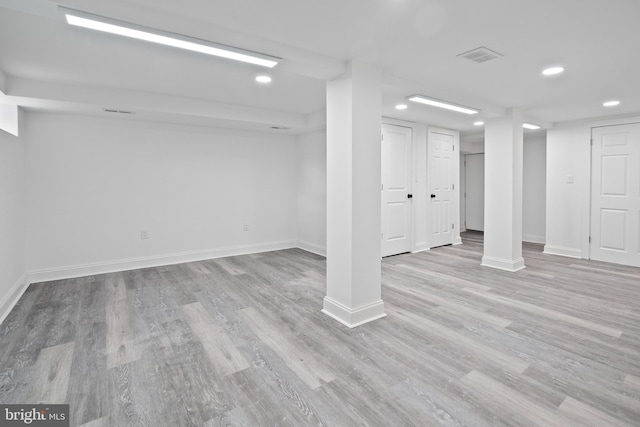 basement featuring light hardwood / wood-style flooring