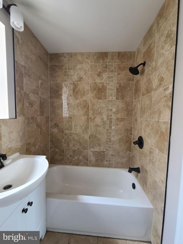 bathroom featuring vanity and tiled shower / bath combo