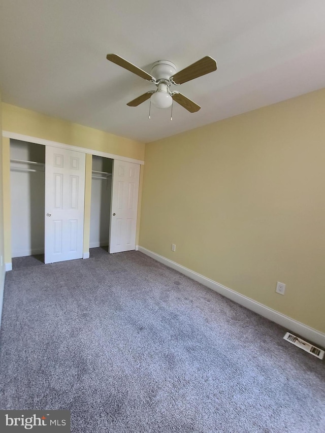 unfurnished bedroom with carpet and ceiling fan