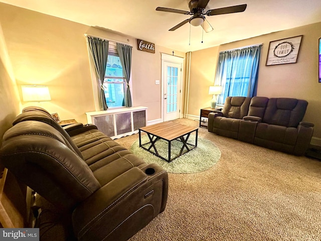 living room featuring carpet flooring and ceiling fan