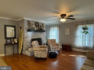 living room featuring crown molding, plenty of natural light, ceiling fan, and hardwood / wood-style flooring