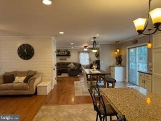 dining room featuring hardwood / wood-style flooring and crown molding