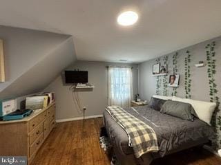 bedroom featuring dark hardwood / wood-style floors