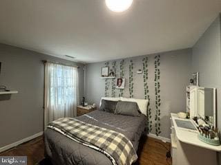 bedroom featuring dark wood-type flooring