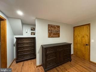 hallway with light wood-type flooring