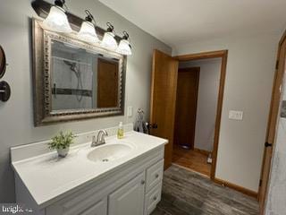 bathroom featuring hardwood / wood-style floors and vanity