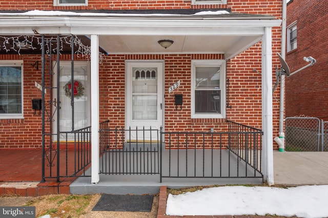 doorway to property featuring covered porch