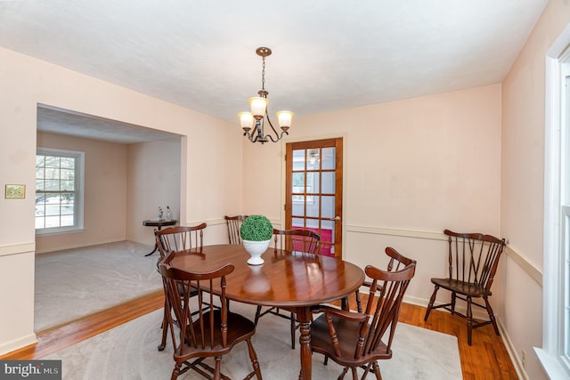 dining area featuring a chandelier and hardwood / wood-style floors