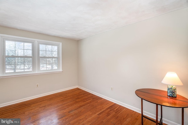 empty room featuring hardwood / wood-style floors and a textured ceiling