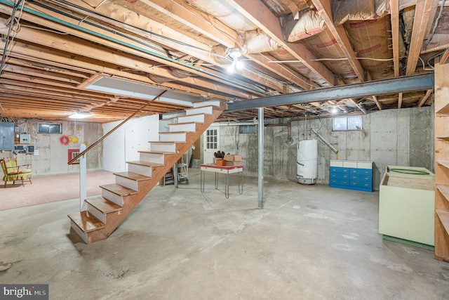 basement with gas water heater and electric panel