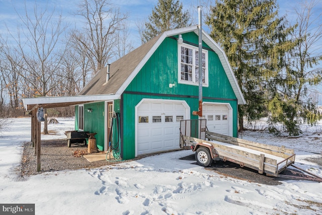 view of snow covered garage