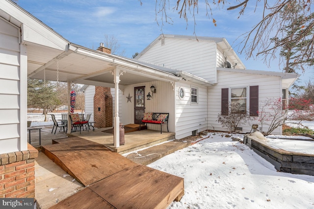 view of snow covered house