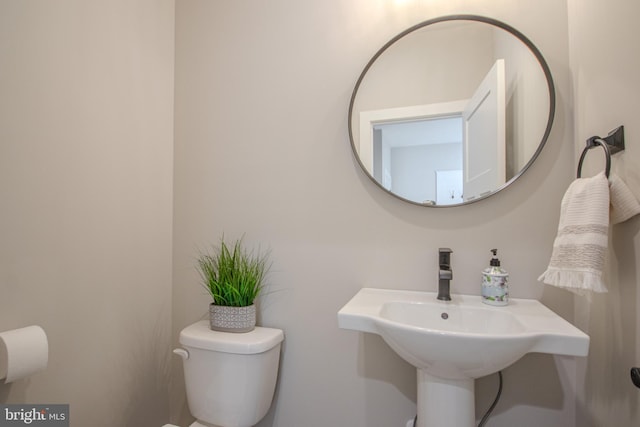 bathroom with toilet and sink