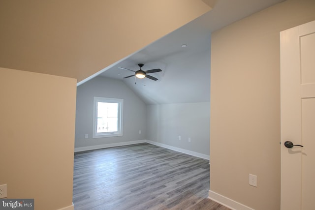 additional living space with light hardwood / wood-style floors, ceiling fan, and lofted ceiling