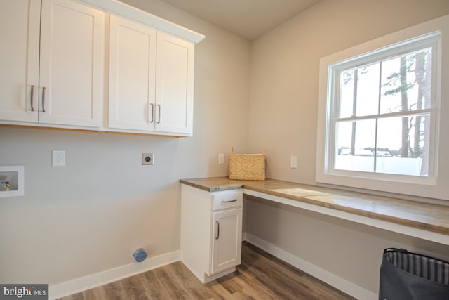 washroom featuring cabinets, hookup for a washing machine, hardwood / wood-style flooring, and hookup for an electric dryer