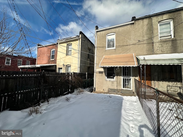 view of snow covered house