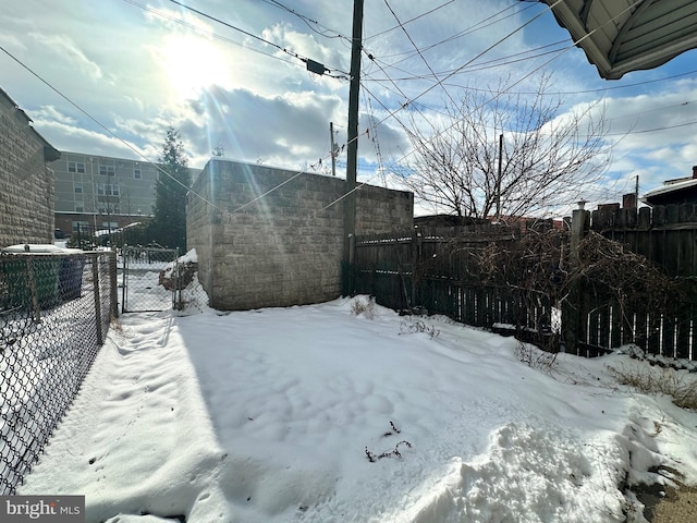 view of yard covered in snow