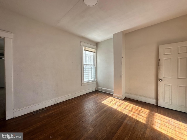 unfurnished bedroom featuring hardwood / wood-style floors