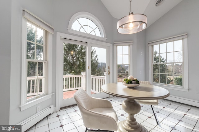 sunroom featuring lofted ceiling and baseboard heating