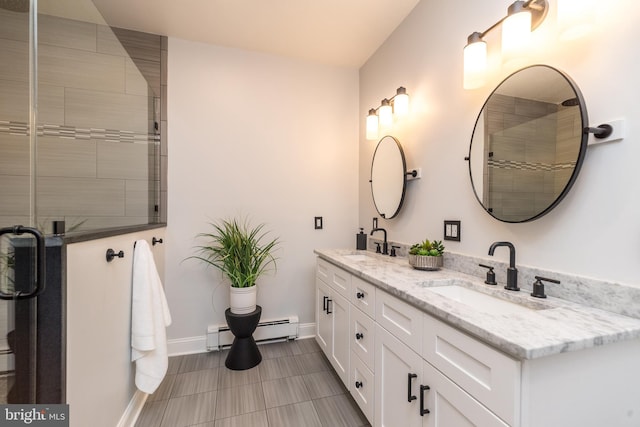 bathroom with vanity and a baseboard radiator