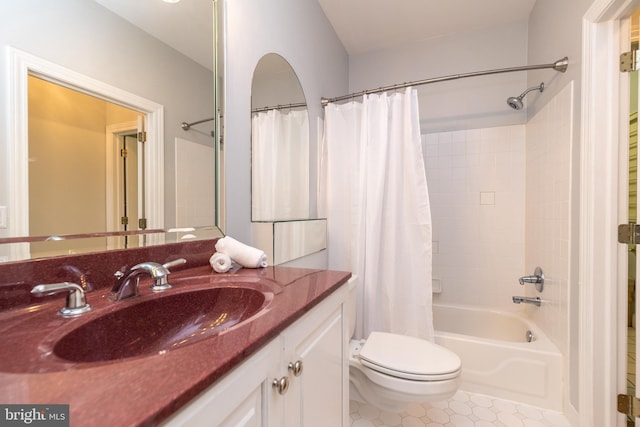 full bathroom with toilet, vanity, tile patterned floors, and shower / tub combo with curtain