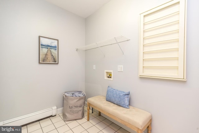 laundry area featuring light tile patterned floors, baseboard heating, and hookup for a washing machine