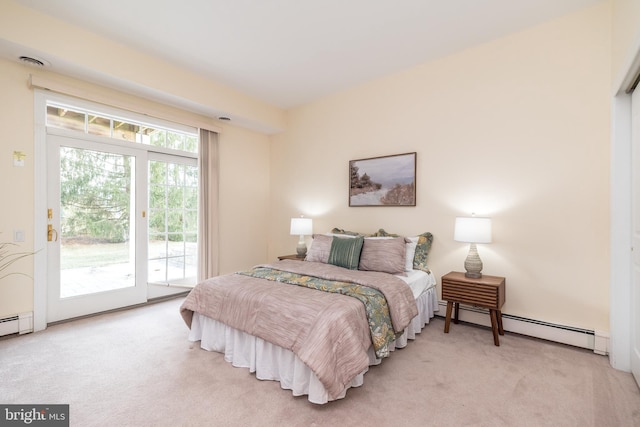 carpeted bedroom featuring access to outside and a baseboard radiator