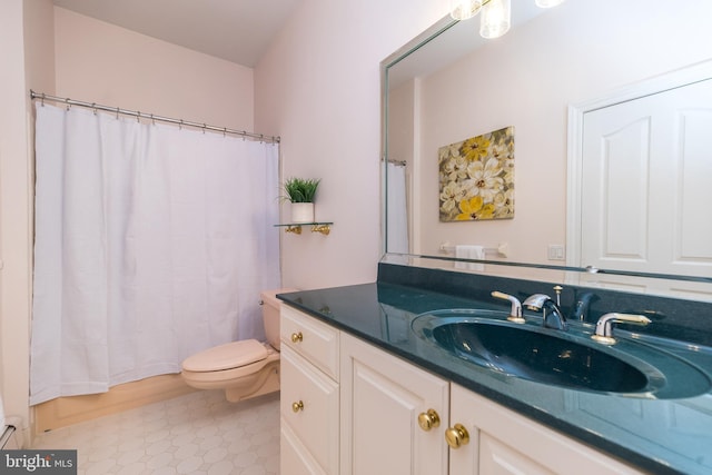 bathroom with toilet and vanity