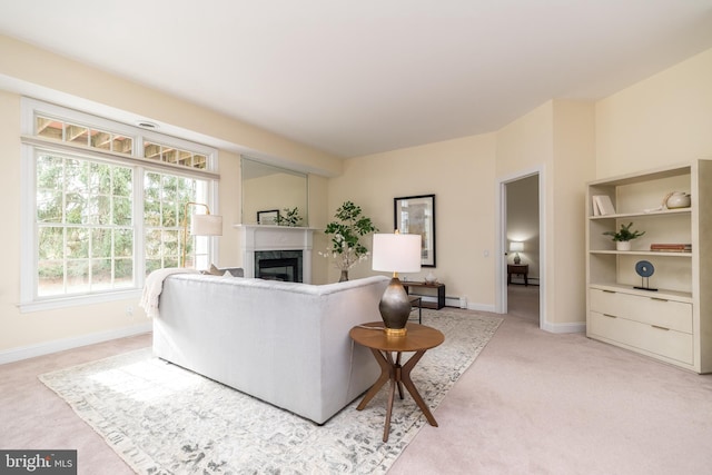 carpeted living room with a premium fireplace and baseboard heating