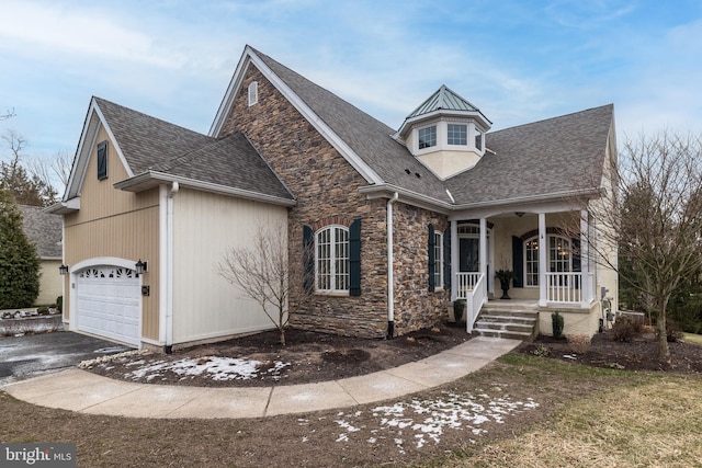 view of front of house with covered porch and a garage