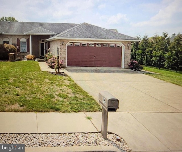 ranch-style house with a front yard and a garage