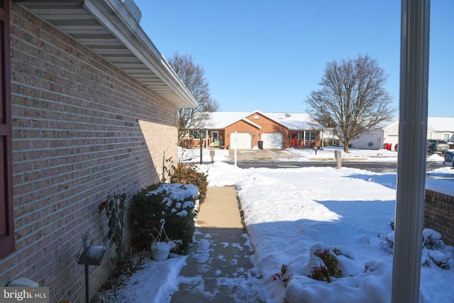 view of yard layered in snow