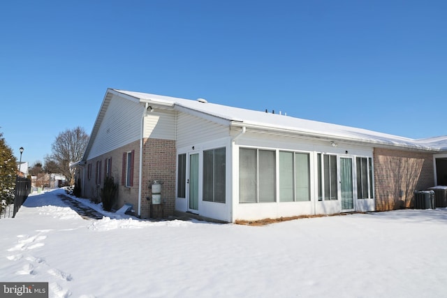 view of snow covered house