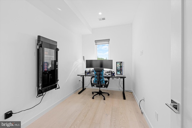 home office with light wood-type flooring