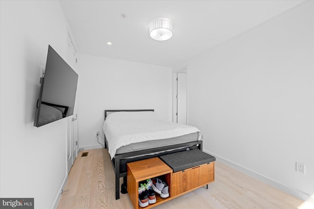 bedroom with light hardwood / wood-style floors