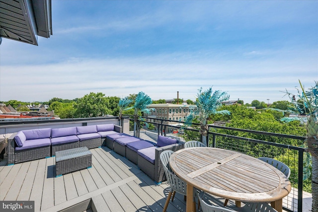 wooden terrace with an outdoor hangout area